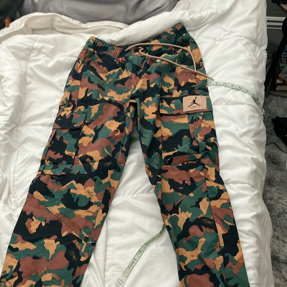 Jordan camo pants. Waterproof like material. 30 inch inseam.